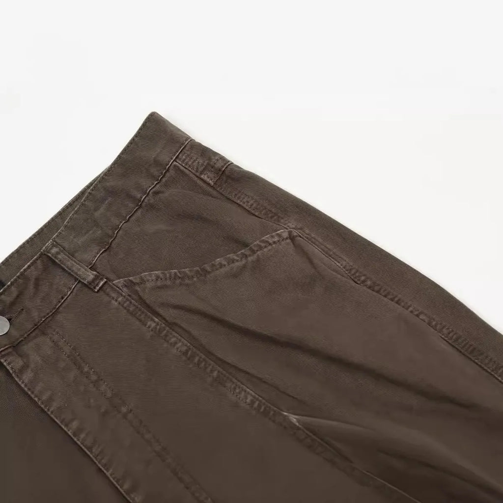 Men's brown loose straight wide-leg high-waisted cotton trousers laid flat.
