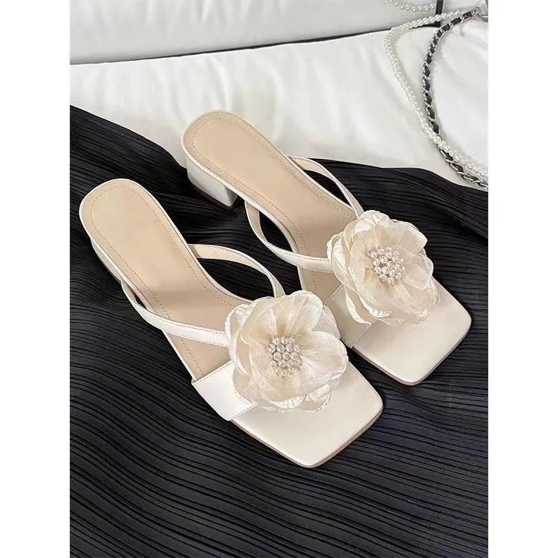 Women's cream white sandals with chunky heel, square toe, and a single satin strap.
