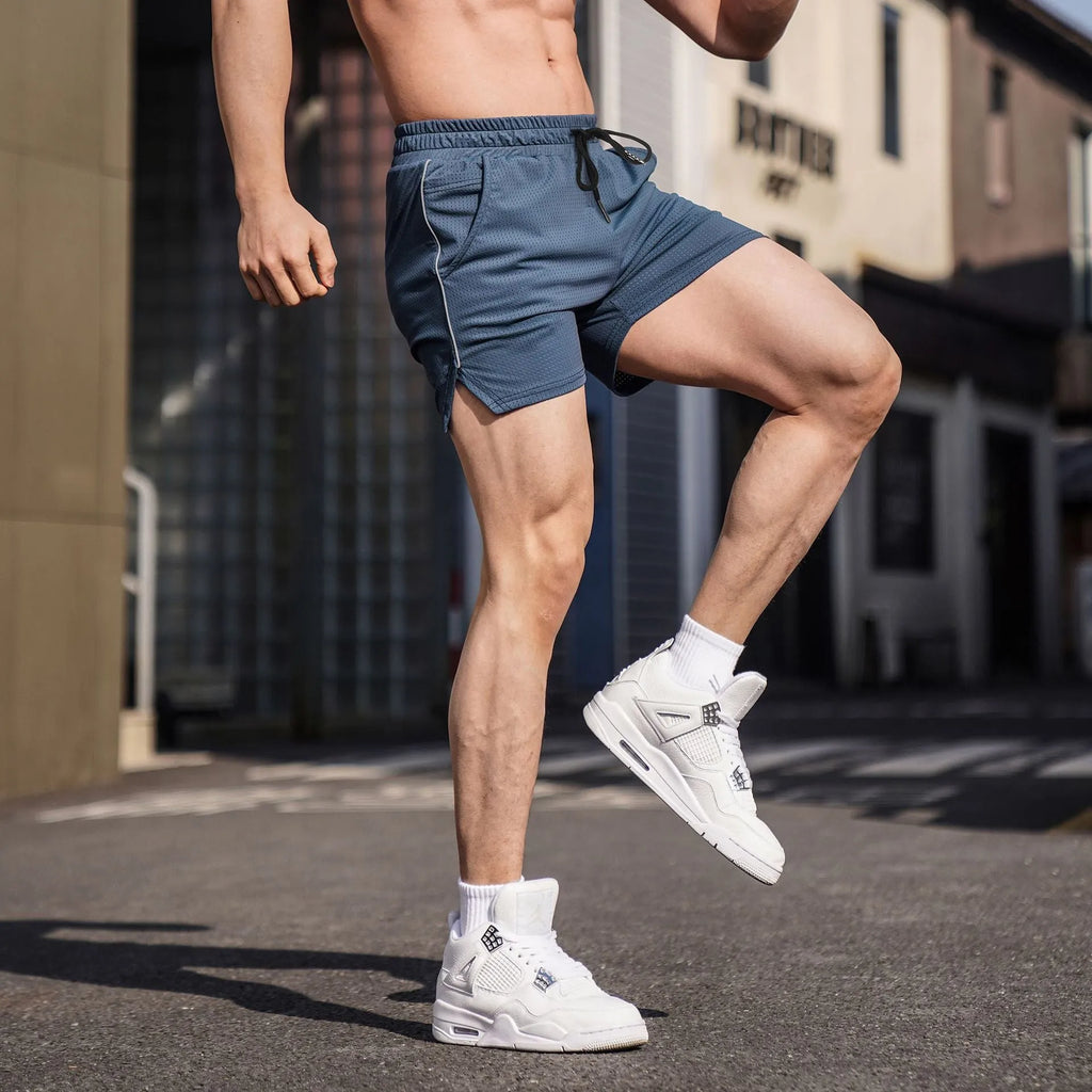 Men's straight-cut polyester fitness shorts in grey, shown on a hanger.