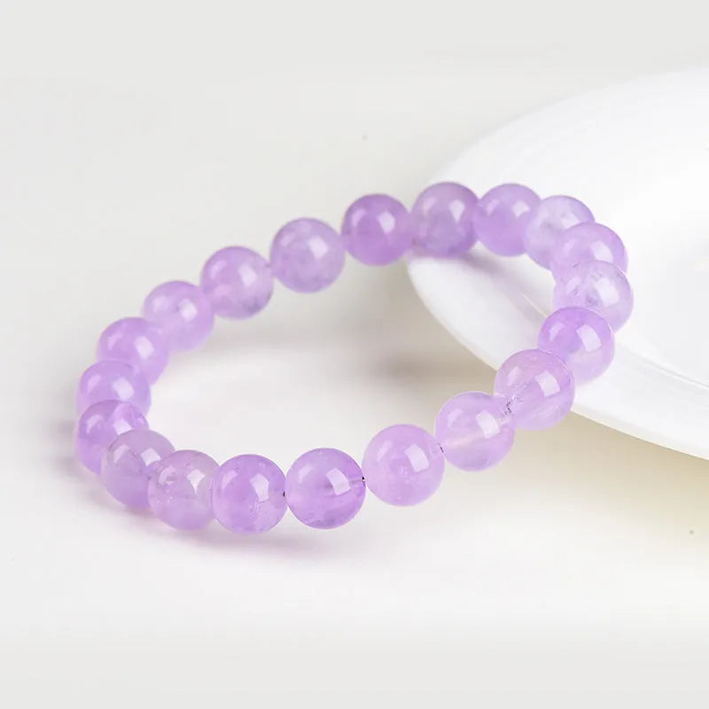 Lavender amethyst crystal bracelet with geometric round beads showing water ripple pattern