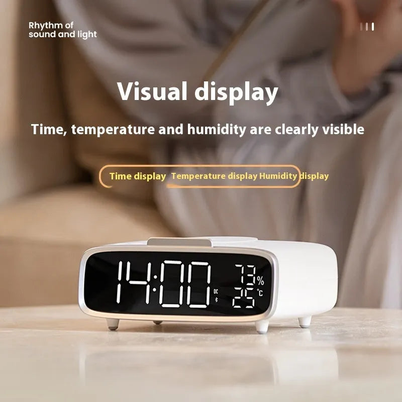 White ABS acrylic Bluetooth speaker with wireless charging pad and integrated night lamp