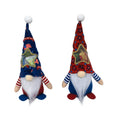 Two faceless baby doll Christmas ornaments dressed in red reindeer suits with white trim, made from cloth.