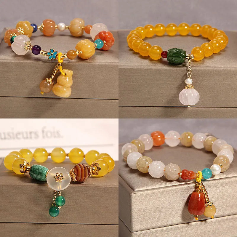 Women's yellow agate and crystal adjustable wrap bracelet on gold silk thread in khaki.