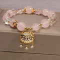 Women's yellow agate and crystal adjustable wrap bracelet on gold silk thread in khaki.