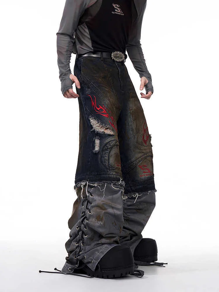 Men's retro style denim jeans with detachable trouser legs in a wide leg, loose fit.