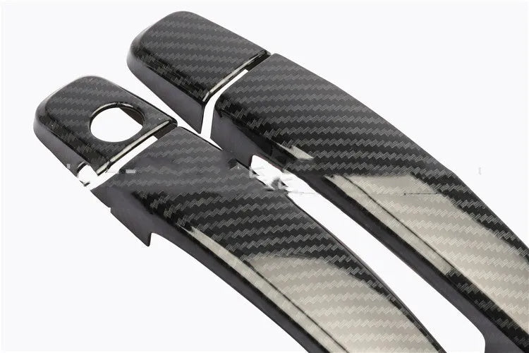 Carbon fibre pattern door handle cover for Opel Vauxhall Astra H and J car interior.