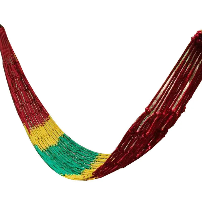 Bold style outdoor nylon rope mesh hammock hung between two trees.