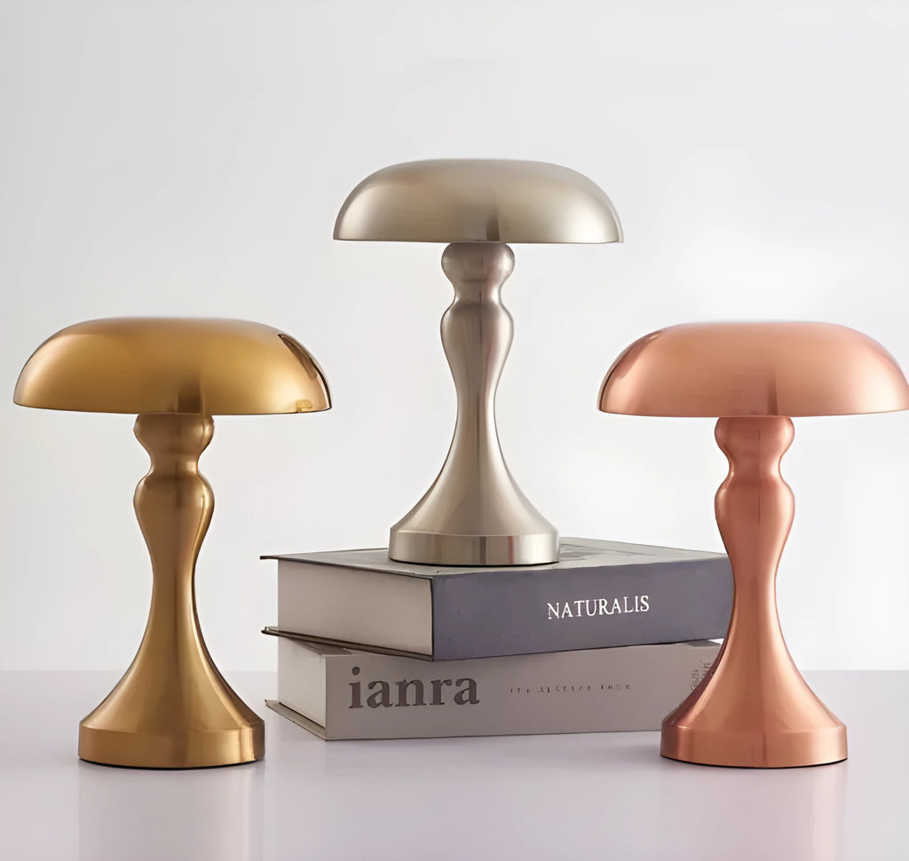 Metallic bronze USB rechargeable LED desk lamp with touch control on a wooden desk