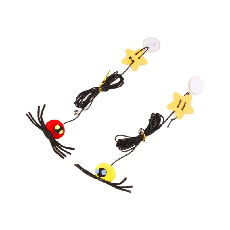 Red and yellow hanging door cat toy with feather, bell, spider, and elastic rope for interactive pet play