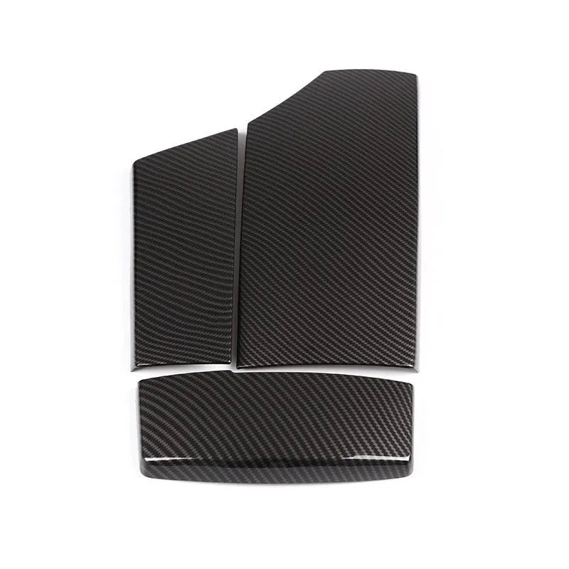 Three ABS carbon fibre pattern armrest box protective covers showing diagonal weave pattern and buckle installation system
