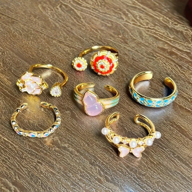 Women's adjustable copper ring with gourd design, flower and bow motifs, and inlaid zircon stones in a vintage oil dripping finish.