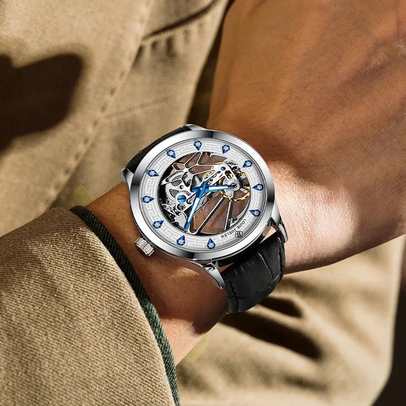 Men's silver case mechanical watch with white dial, blue hands, black leather strap, and butterfly buckle
