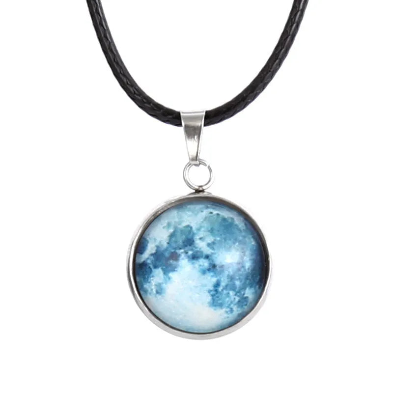 Luminous alloy necklace with a glass pendant depicting a Christmas moon night sky, showing the extension chain.
