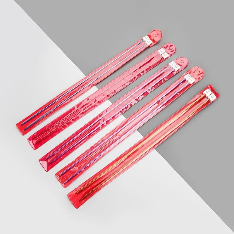 Set of long-handle metal crochet hooks with protective end caps arranged by size