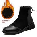 Women's black Martin boots with side zipper, round toe, and decorative bow detail