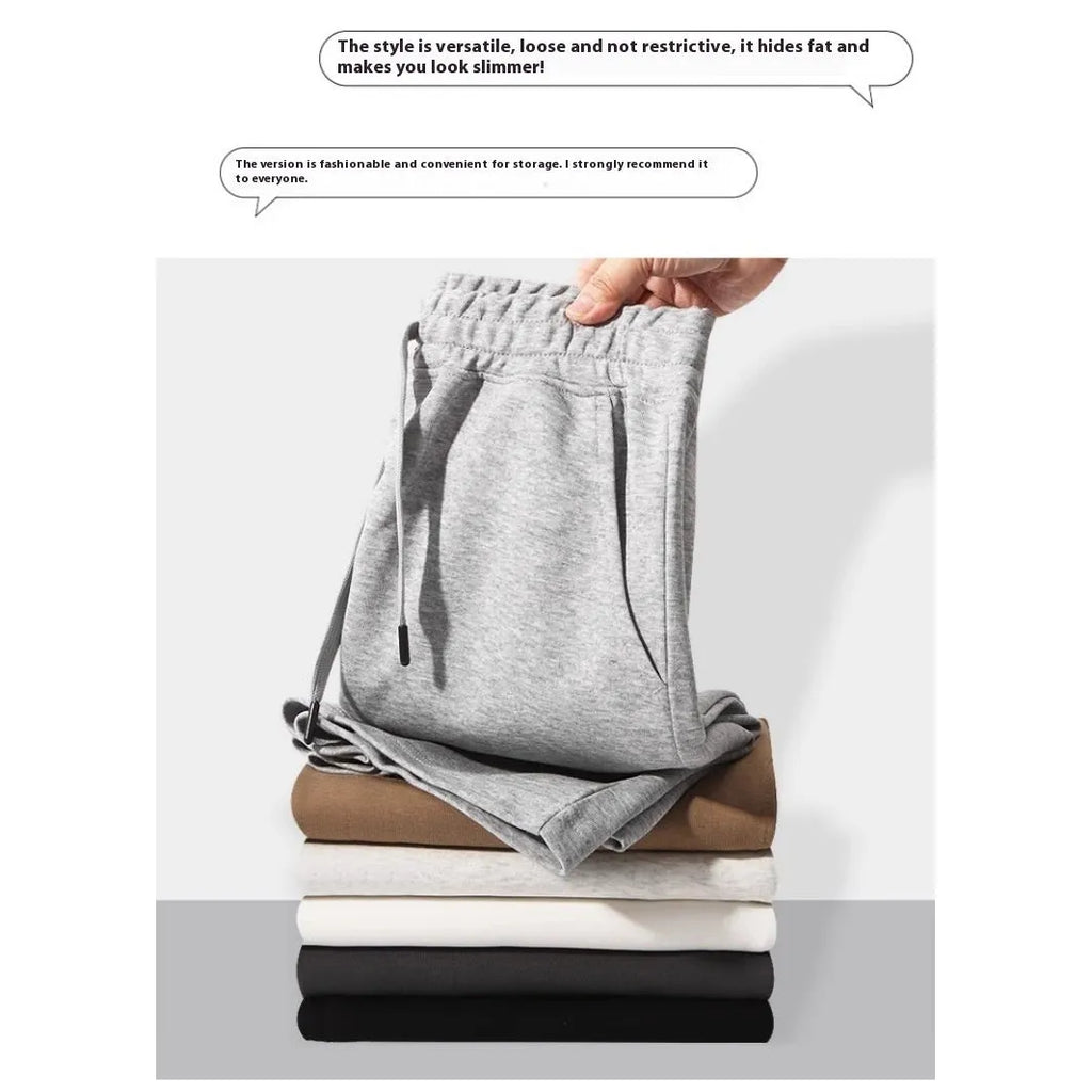 Men's and women's straight cut cotton sports shorts in multiple colours on a plain background.