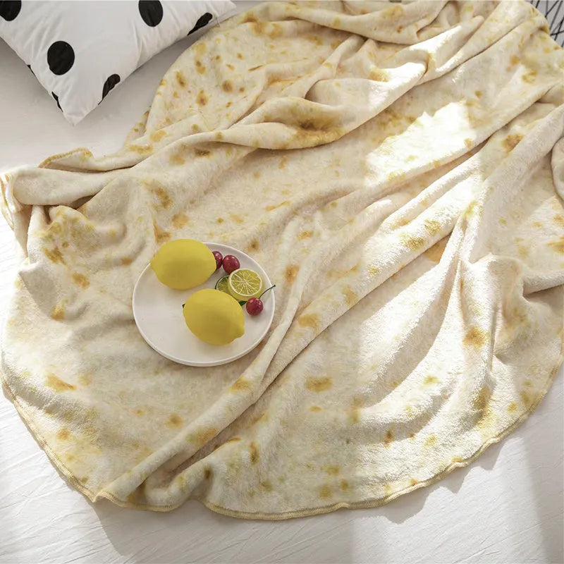 Round flannel burrito blanket with food-themed printing, shown in coral fleece fabric.