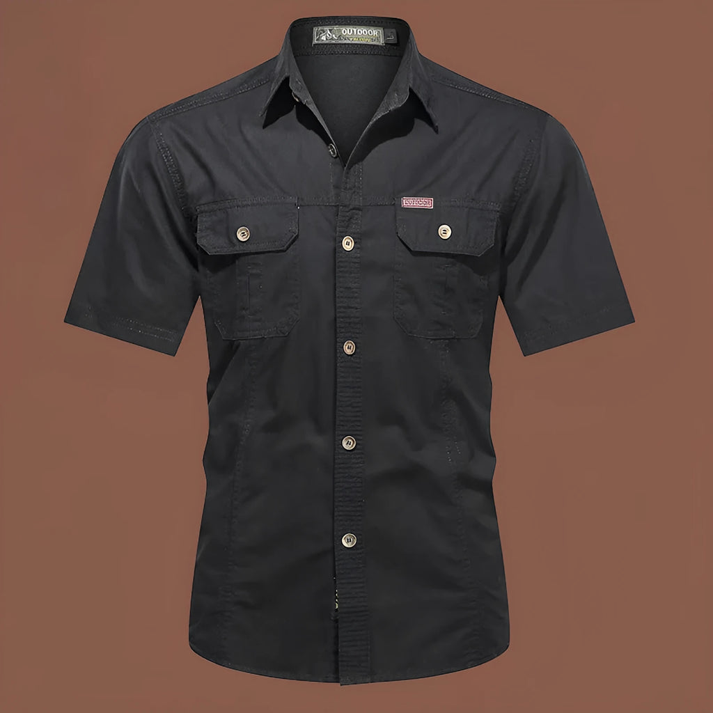 Men's army green cotton work shirt with short sleeves and non-iron finish on a hanger.