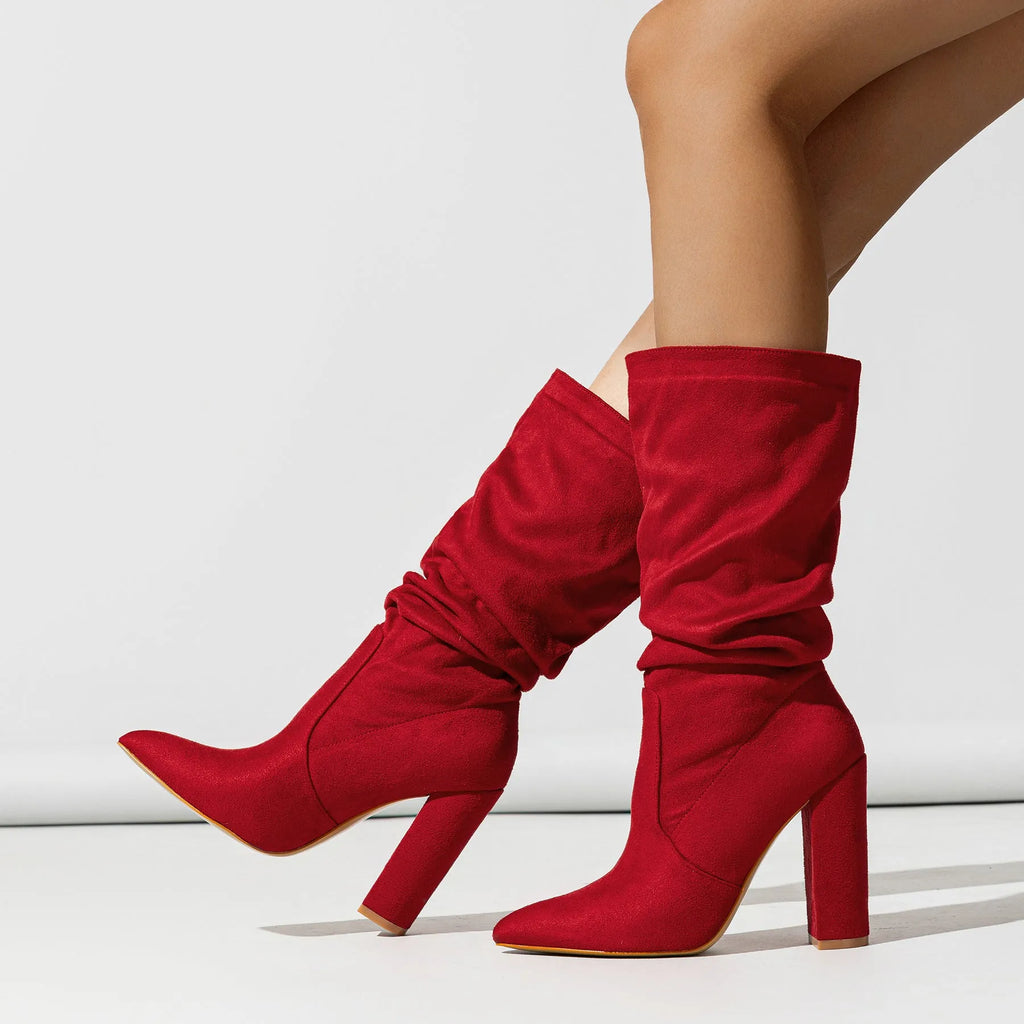 Women's black suede chunky heel boots with a pointed toe and middle-calf shaft.