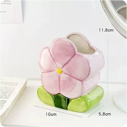 Ceramic flower pen holder storage box in floral pattern colours on desktop