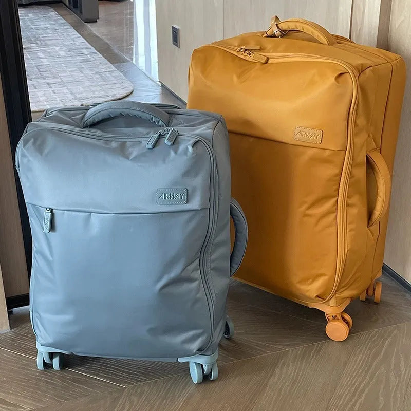 Ultra-light waterproof Oxford cloth suitcase in bluestone green with universal wheels