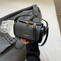 Women's black PU leather messenger bag with horizontal square shape and single shoulder strap