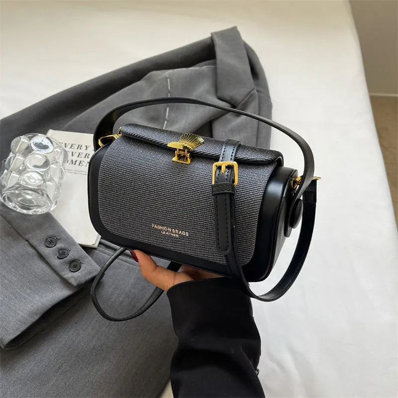 Women's black PU leather messenger bag with horizontal square shape and single shoulder strap