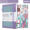 A5 undated notebook with PU leather cover in six colours, open to show flat-lay binding and planning stickers.
