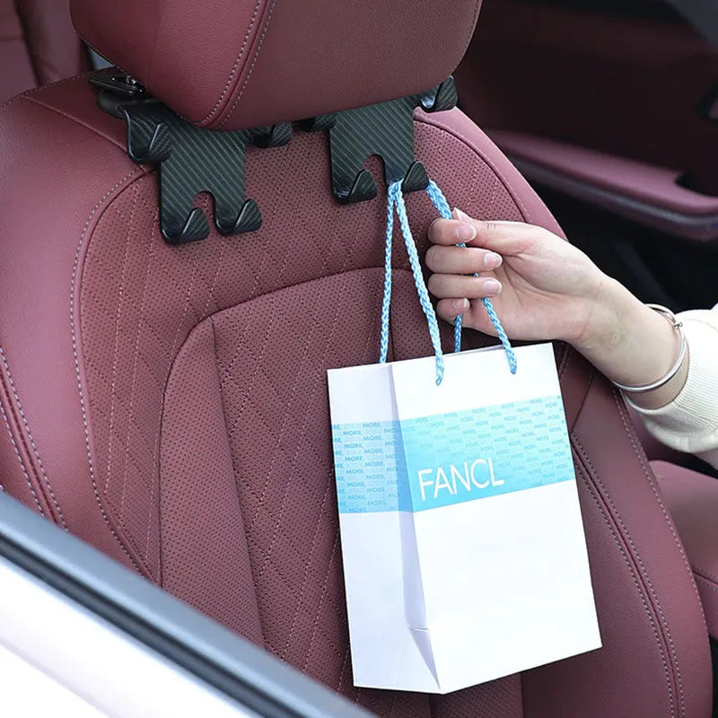 Black ABS plastic car hook bracket with integrated phone holder, shown from the side.