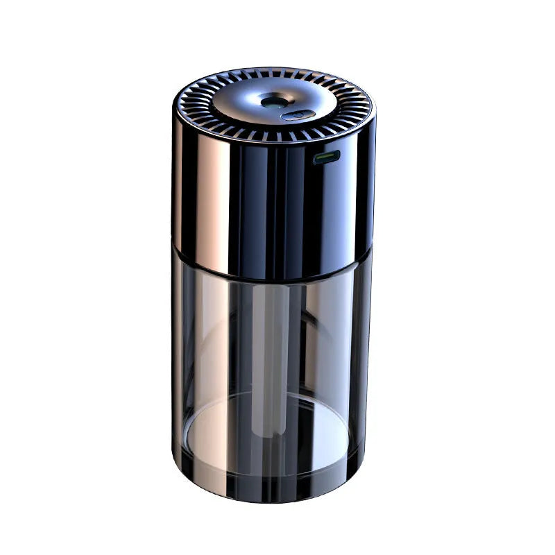 Compact USB plug-in spray perfume humidifier with glass seat on a desk.