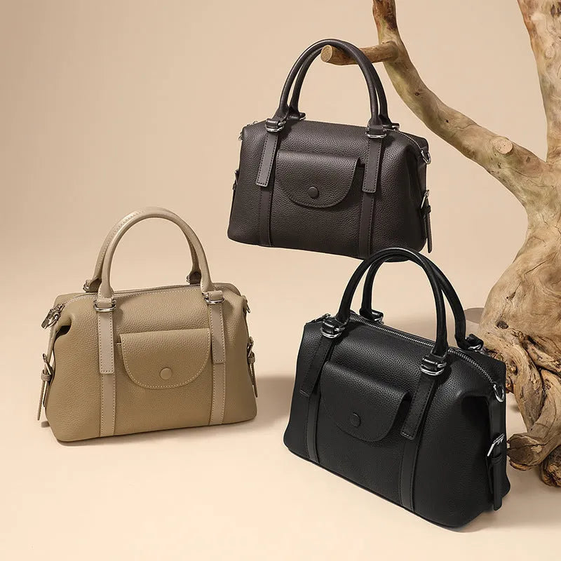 Genuine leather ladies handbag with contrast stitching and lock detail in street-trend style