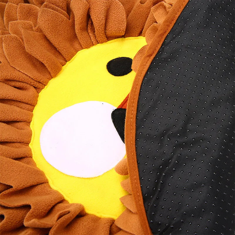 Brown lion-pattern snuffle mat for dogs and cats on a floor, showing plush hiding sections.