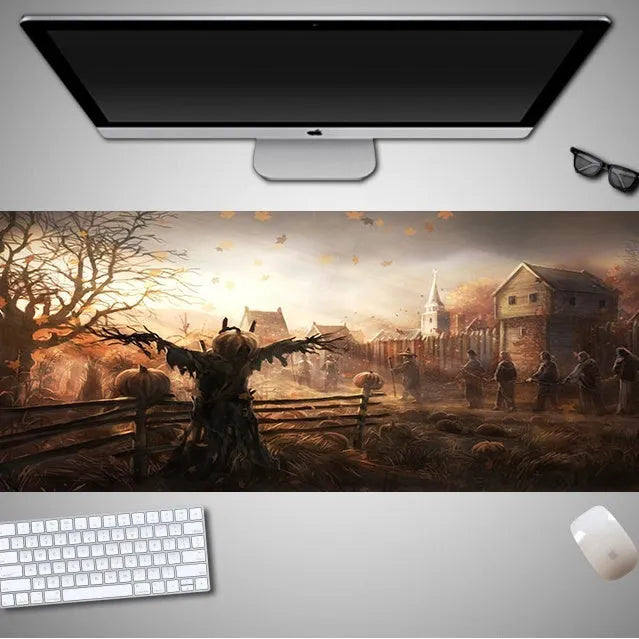 Oversized Halloween-themed rubber cloth mouse pad on a desk, showing non-slip base and large surface area.