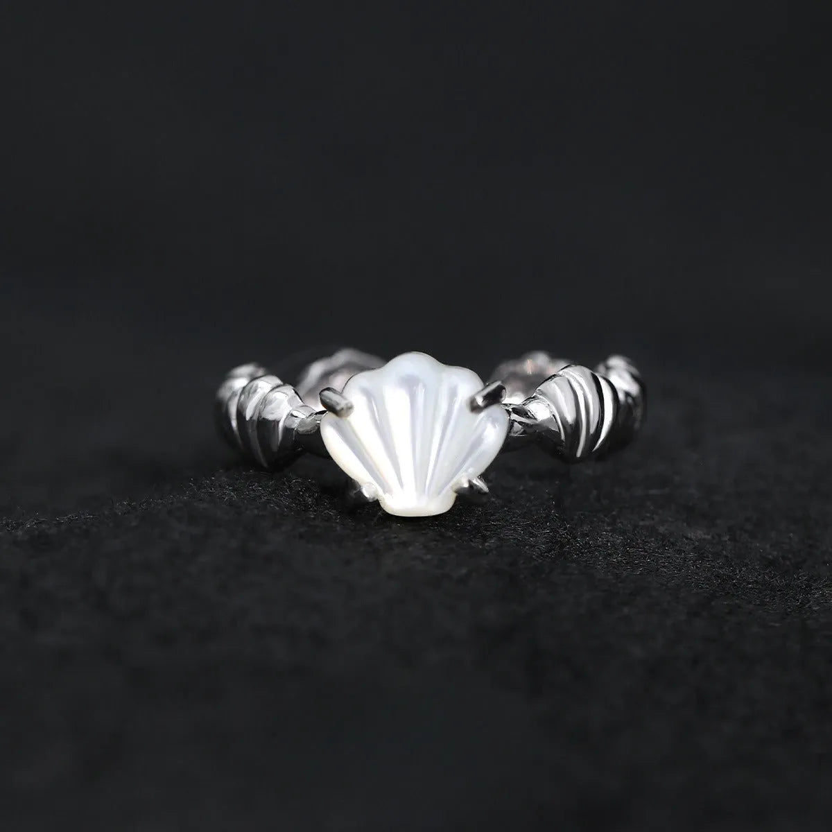 Women's adjustable silver ring with a shell tiger eye design in a gold tone finish.