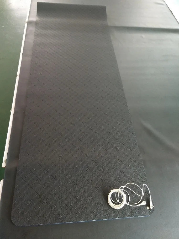 Blue conductive yoga mat with floral pattern and grounding wire for earthing exercises