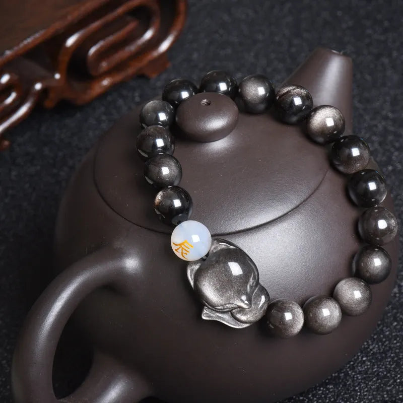 Natural obsidian zodiac guardian bracelet with 10mm beads on an adjustable cord.