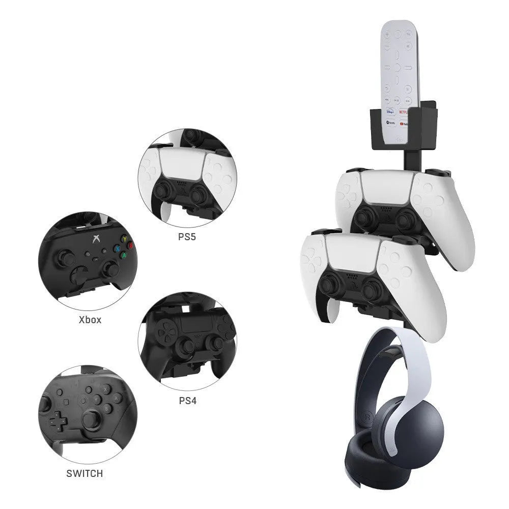 White wall-mounted plastic hook holding a black gaming controller and a headset.