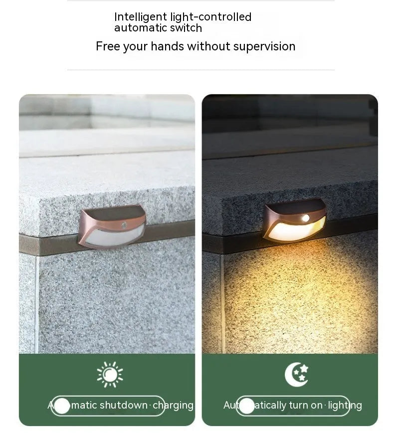 Solar garden wall light with smiley face design for outdoor courtyard illumination