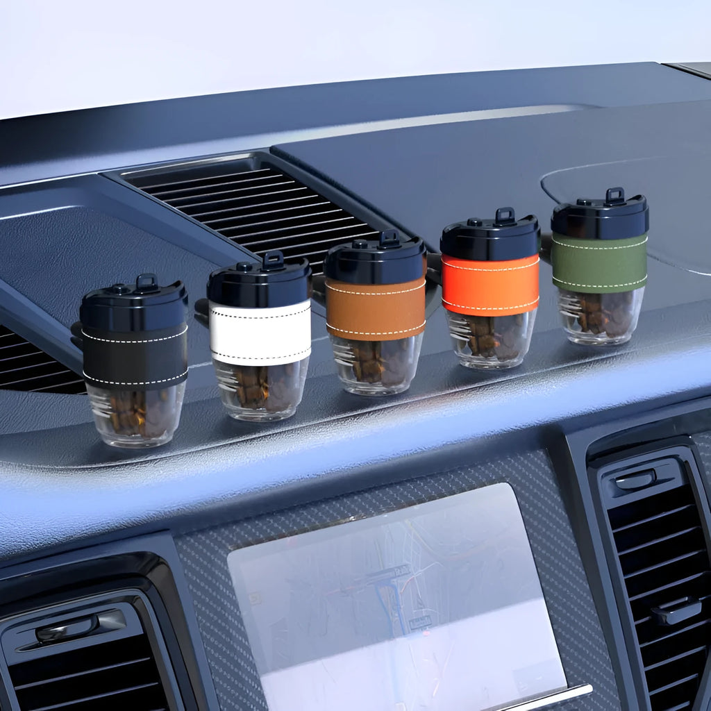 Solid coffee cup shaped car air freshener in black, brown, white, orange or green colour options.