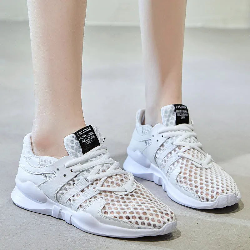 Breathable hollow mesh sneakers in black and white colours with round toe design