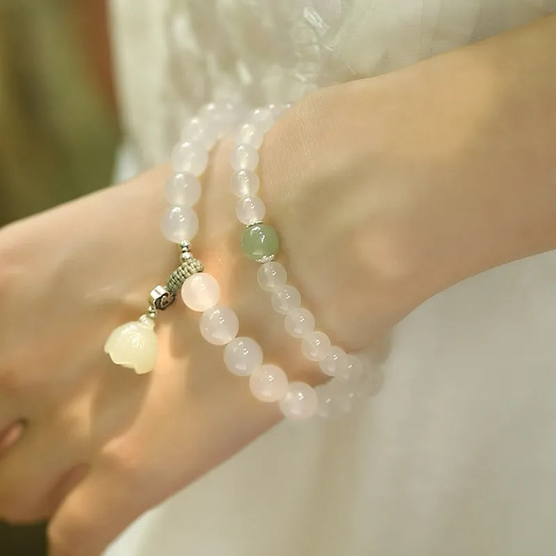 Women's S925 silver bracelet with white agate and Hetian jade stones in geometric lotus design