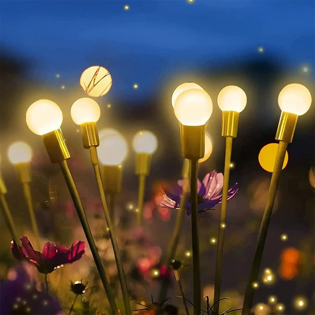 Solar-powered LED firefly ground lamp with multiple heads and ground spike for garden installation