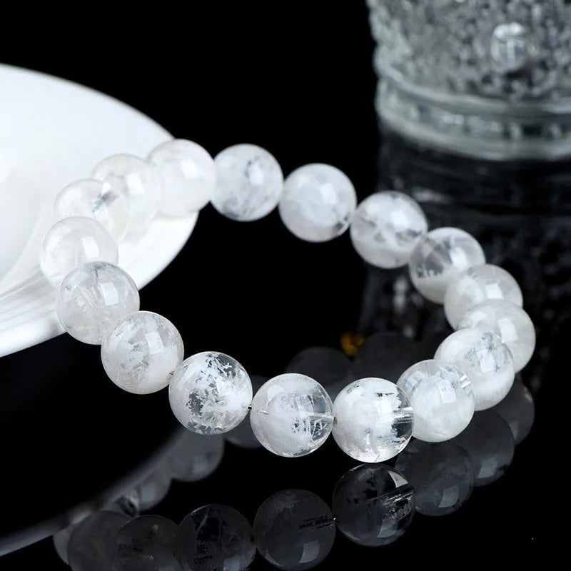 Women's crystal bracelet with natural blizzard snowflake round beads and traditional charm elements