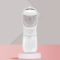 Portable dual-use dog water bottle with split grain cup design in blue, pink, or white colours
