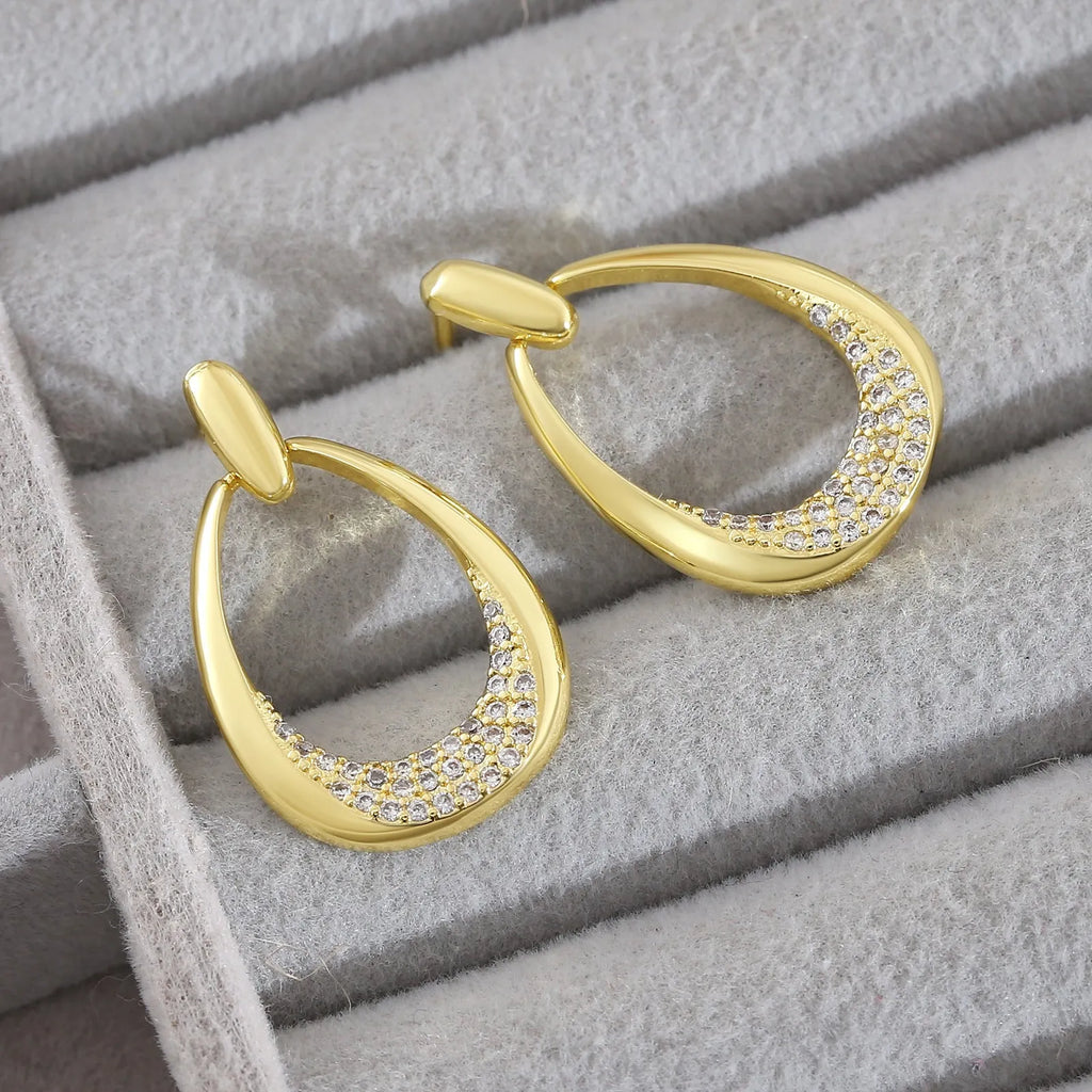 Women's yellow gold geometric drop-shaped ring earrings with copper construction and electroplated finish