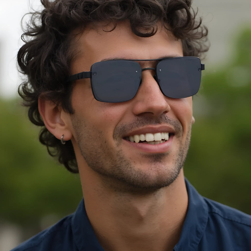 Men's vintage-style sunglasses with UV protection, shown in various colour options on a model.