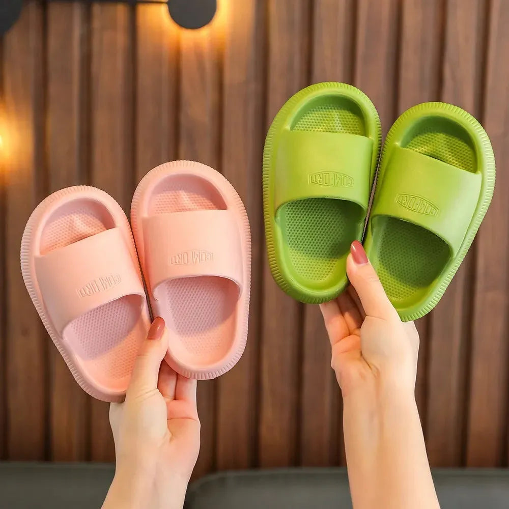 Children's EVA injection-moulded slippers with non-slip soles in mixed colours, shown in multiple sizes.