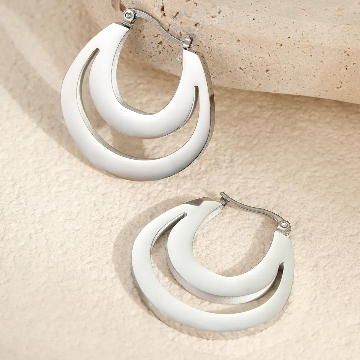 Geometric French earrings with round ring design in gold or steel metallic colours