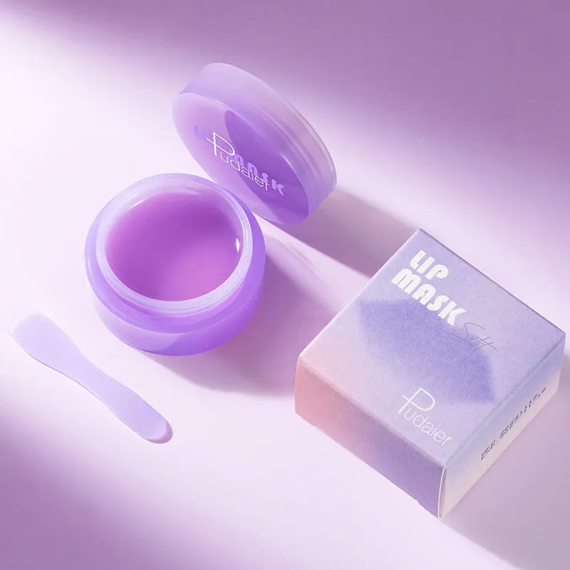 Lip exfoliating balm mask with 10ml tube and white silicone scraper tool on a pink background.