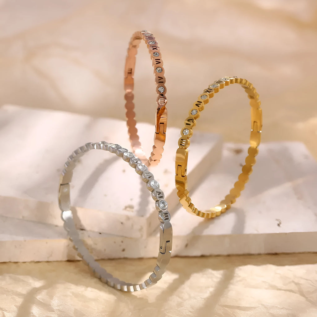 Korean style titanium steel bracelet with numerical design in gold, rose gold, and steel colour options.